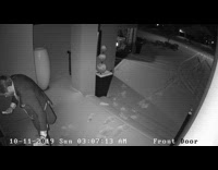 Security cam of guy slipping in snow in front of house