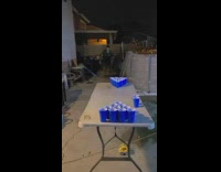 Guy jumps on beer pong table 