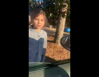 Girl asks little girl if she wants candy 