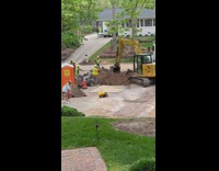 Bulldozer fills small toy truck with dirt 