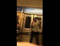 guy in grey sweatshirt pretends to box on subway
