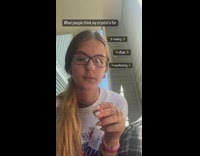 Girl packs joint with crystal necklace