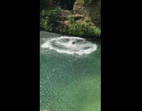 slow motion woman back flips slaps back