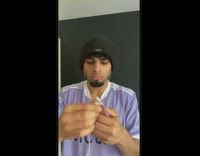 Guy adjusts earphone cord until song plays without skipping 