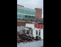 Guy cut customer hair salon at rooftop