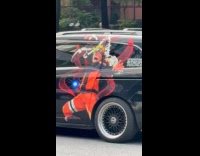 Black SUV with Naruto sticker on side