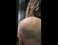 Bald guy has one strand of hair 