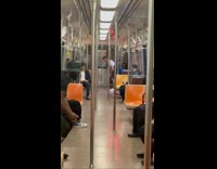 Guy plays golf while riding the subway