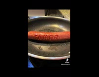 Girl writes her name on sausage 