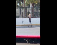 Woman roller skates tiktok dance at rink