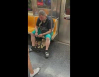 Pet owner sits with dog and snake around neck on subway 