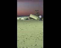 Woman lay down upside down boat sundown