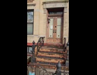 Huge reindeer inflatable in alley between buildings