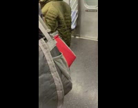 Guy red jacket breaks up fight between two guys on subway train
