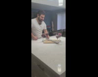 Guy cheers with wine by himself 