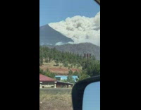 Guy drive car film mountain on fire