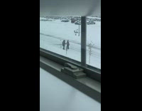 Couple hold hands dance outside on snow