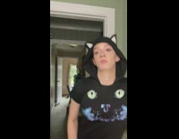 Woman cat hoodie bump head on door frame