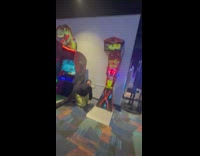 Girl punches boxing machine and falls