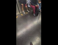 Bunch of train passengers wear dark red pants 