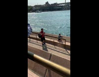 Kid waits mom and dad take photos 