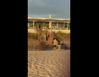 Woman red checkered polo sit stairs pictorial