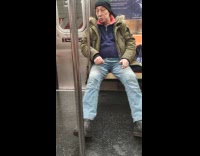 Old man smokes inside the subway train