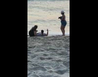 Girl sits straddles guy photographer beach pt. 2