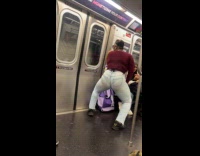 Woman maroon top twerk on train ride