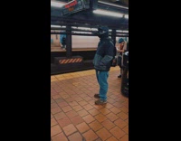 Guy in subway wearing a black crow plague mask