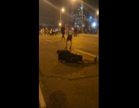 Collab IITW - Man shiny top poses middle of street