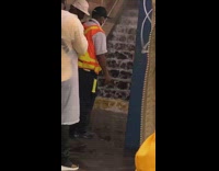 Water flows down subway train station stairs 