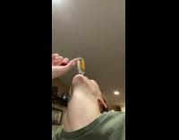 Woman drinks small bottle of alcohol