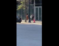 Girl brown skirt hold glass wall street