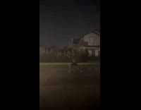 Man hold USA flag outside windy typhoon