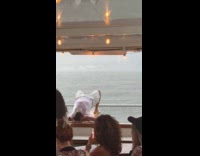 Man on ferry plank soaked in rain