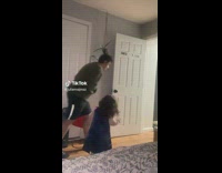 Guy pretends to race little girl closes door 