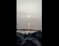 Boat sail across ocean on time lapse