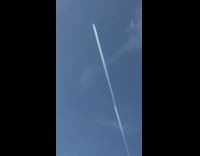 Plane with a smoke trail followed by another plane