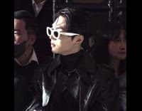 Man on Willy Wonka Eyeglasses Watches Fashion Show