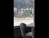 Collab IITW - Woman black dress walks man films behind