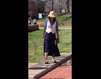 Woman in white vest blue dress she doesnt like enchiladas 