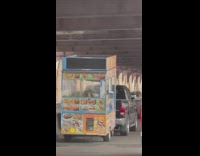 Food stand moved by truck has steam coming out