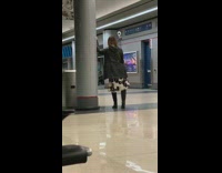 Woman selfie stick airport terminal