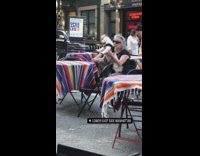 Old woman hold dog street live band part 1