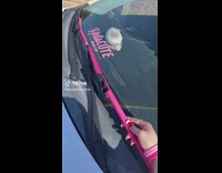 Woman install pink windshields wiper for her car