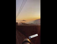 Camera tripod sunrise stone wall orange sky