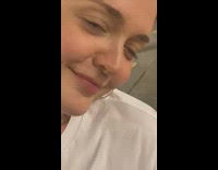 Woman taking a selfie video with a rat roaming around 