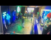 Man dances inside the Halloween attraction booth