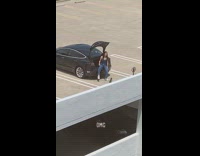 Girl sit car trunk throw shoe fail